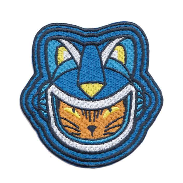 Unique embroidered patch of a cat wearing a futuristic blue helmet, blending animal and sci-fi themes for a playful, modern design.