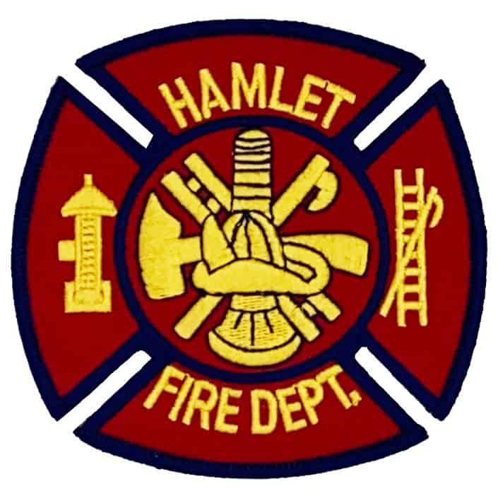 Hamlet Fire Department patch featuring traditional firefighter symbols like ladder, axe, and hose, honoring fire service dedication and bravery.