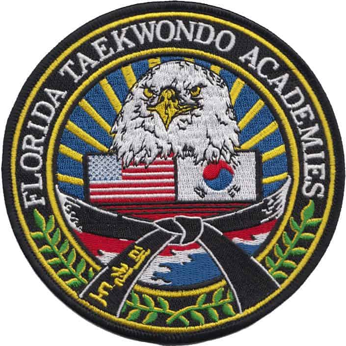 Florida Taekwondo Academies patch featuring an eagle, American and South Korean flags, and a black belt, symbolizing martial arts heritage and unity.