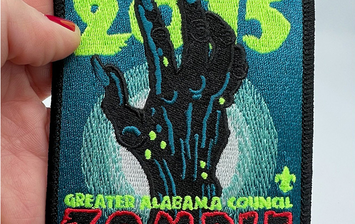 Greater Alabama Council zombie-themed patch with eerie hand design, created for a 2015 scouting event, featuring glow-in-the-dark details.