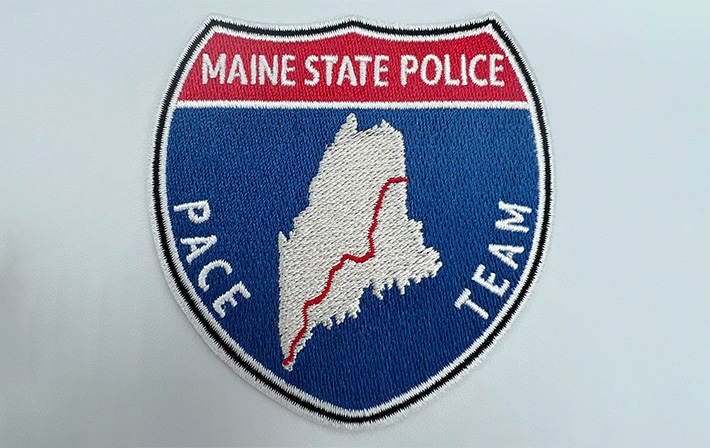 Maine State Police PACE Team embroidered patch with state outline and red route line, symbolizing law enforcement and patrol coverage in Maine.